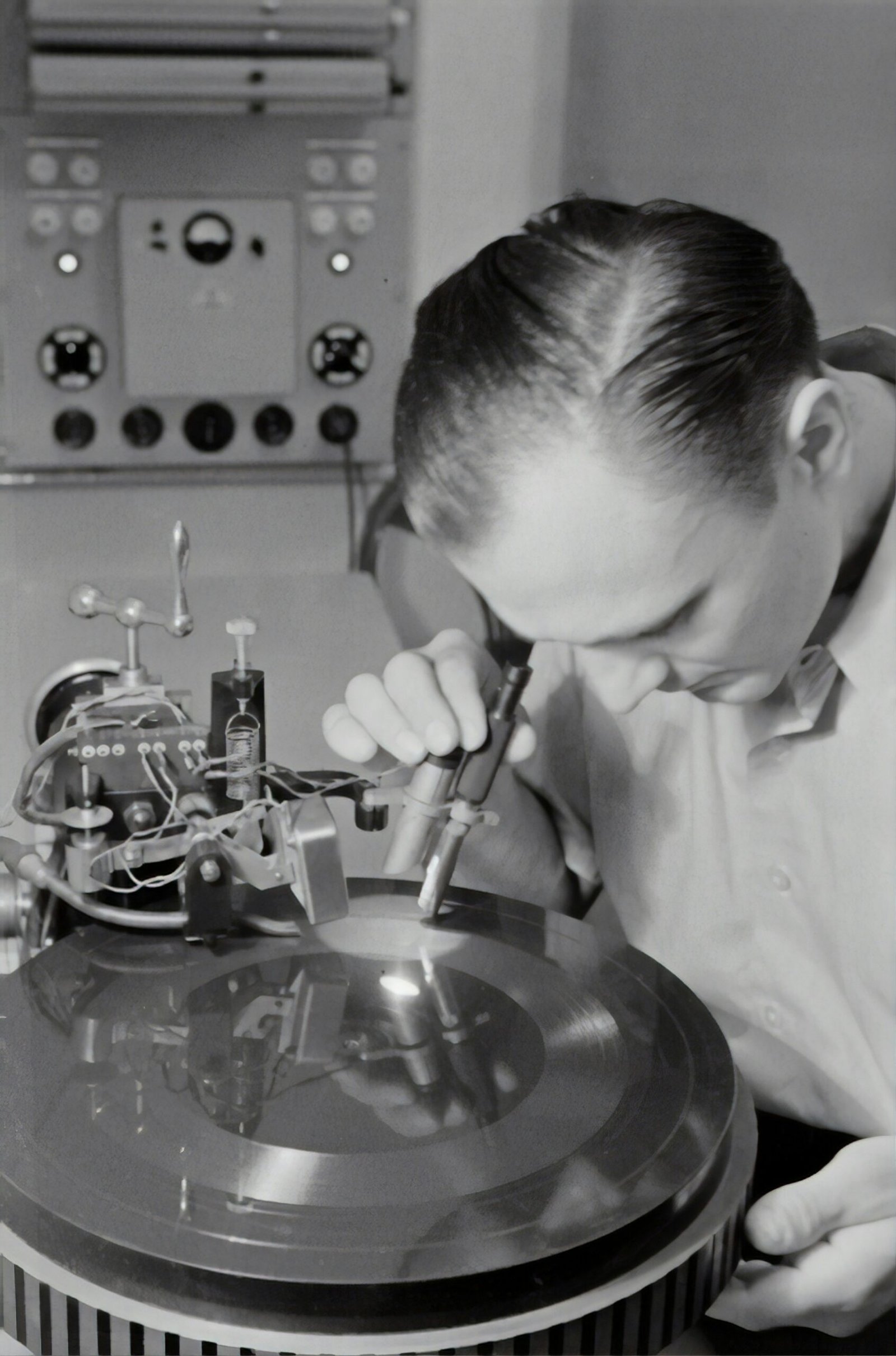 boy in white dress shirt holding silver round tool